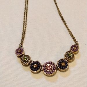 V beautiful linked charms necklace on double faux gold chain.